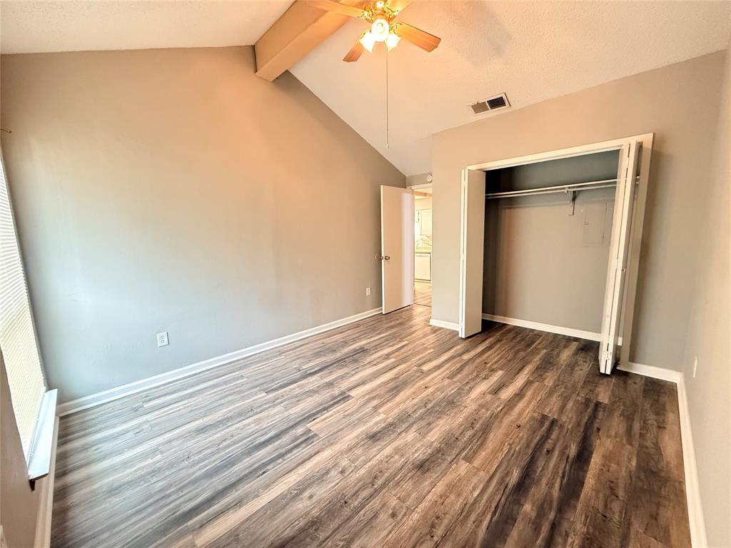 9696 Walnut Street, Unit 813 Dallas, TX 75243 - Photo 14 of 21 a view of an empty room with wooden floor and a window