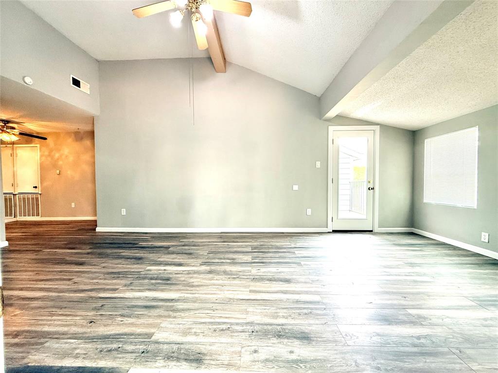 9696 Walnut Street, Unit 813 Dallas, TX 75243 - Photo 3 of 21 a view of a room with window and wooden floor