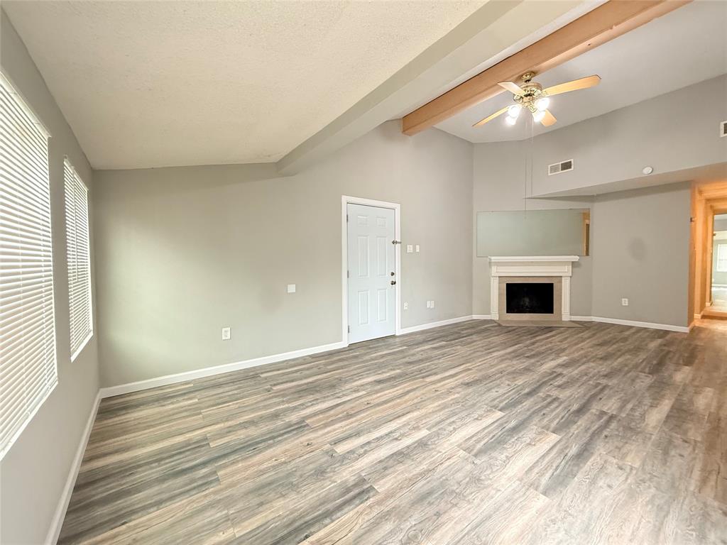 9696 Walnut Street, Unit 813 Dallas, TX 75243 - Photo 6 of 21 a view of empty room with window and fireplace