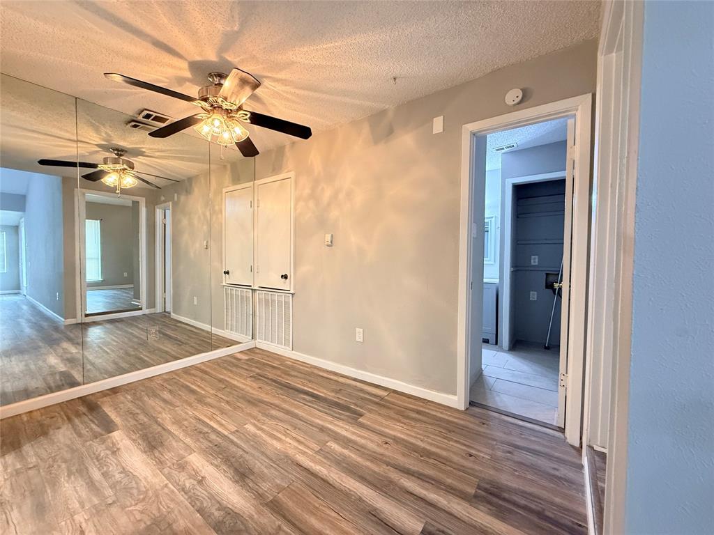 9696 Walnut Street, Unit 813 Dallas, TX 75243 - Photo 8 of 21 a view of a room with a ceiling fan