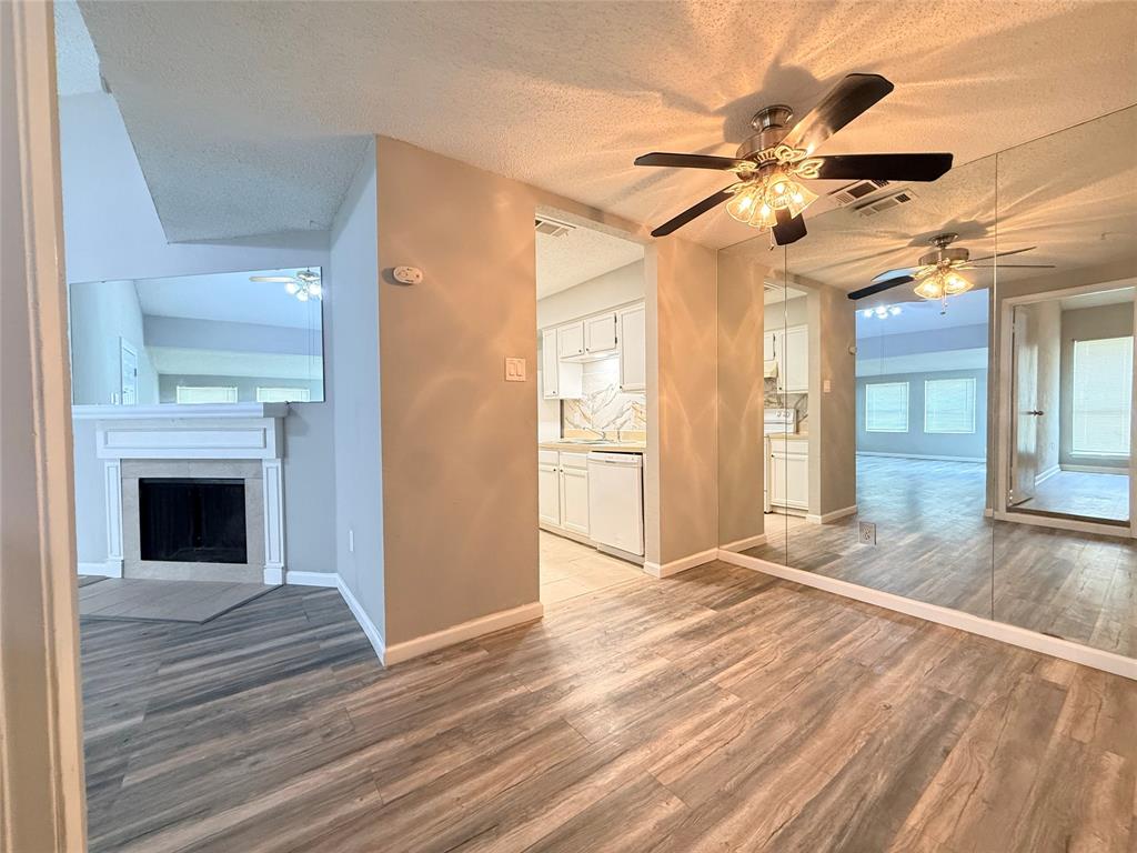 9696 Walnut Street, Unit 813 Dallas, TX 75243 - Photo 9 of 21 a view of an empty room and wooden floor