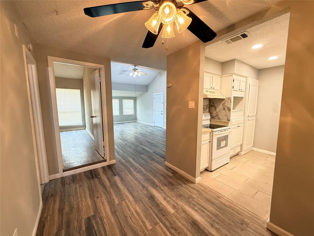 9696 Walnut Street, Unit 813 Dallas, TX 75243 - Photo 10 of 21 a view interior of the house and wooden floor
