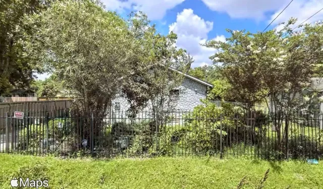 a backyard of a house with lots of green space