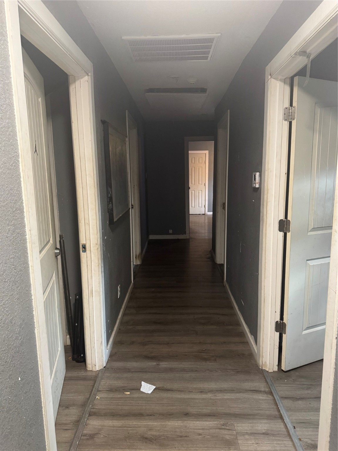 8121 Shotwell Street Houston, TX 77016 - Photo 5 of 8 a view of a hallway with wooden floor and staircase
