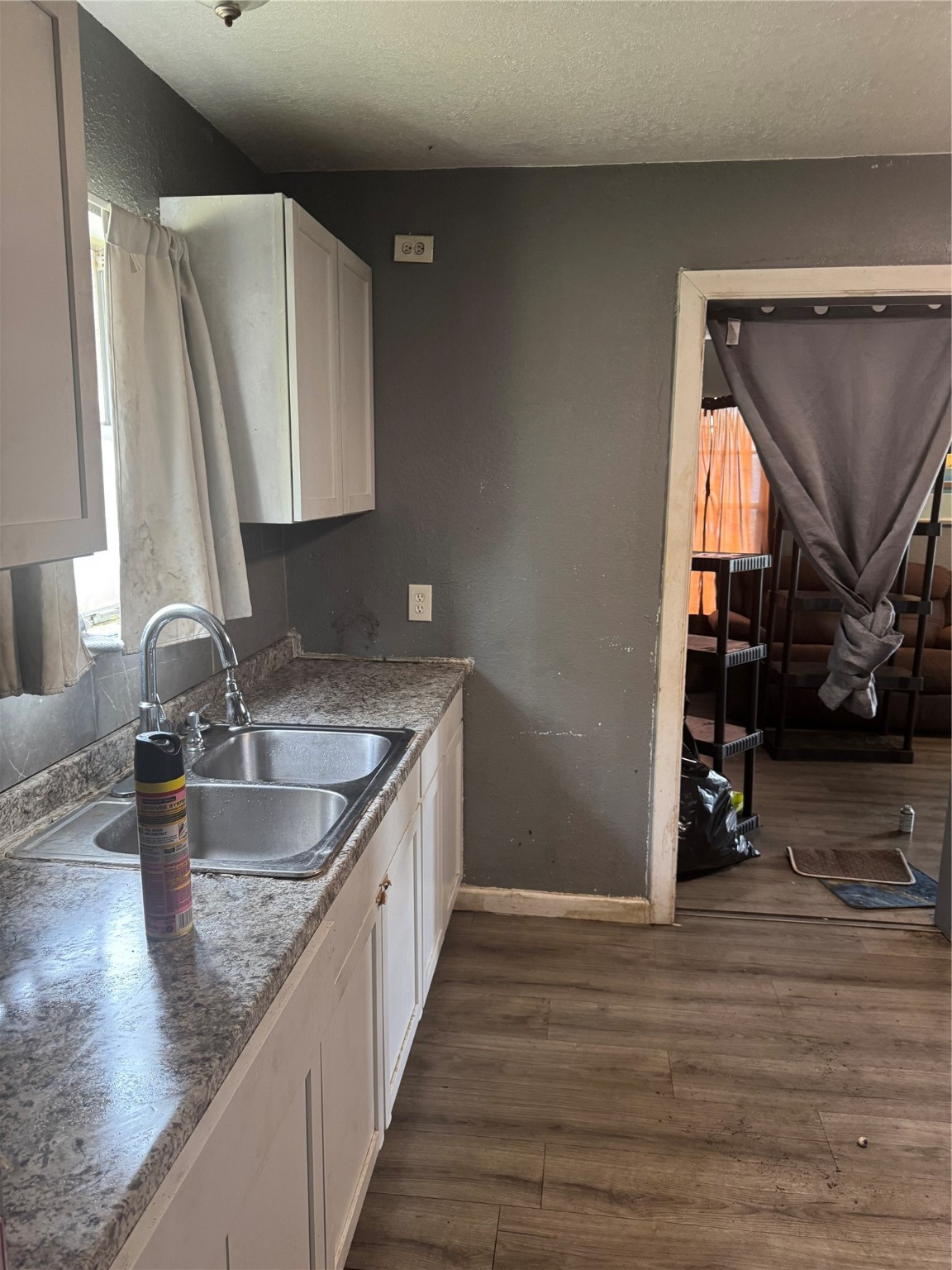 8121 Shotwell Street Houston, TX 77016 - Photo 6 of 8 a kitchen with stainless steel appliances granite countertop a sink stove and cabinets