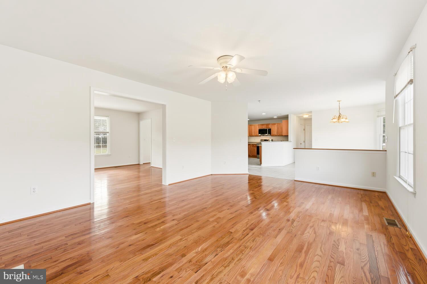 30224 Chestnut Ridge Lane Trappe, MD 21673 - Photo 14 of 46 a view of empty room with wooden floor