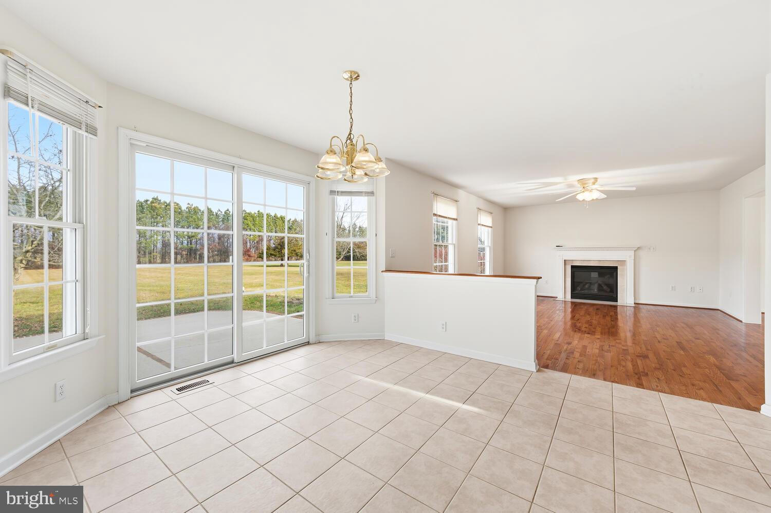 30224 Chestnut Ridge Lane Trappe, MD 21673 - Photo 15 of 46 a view of an empty room with window and cabinet area
