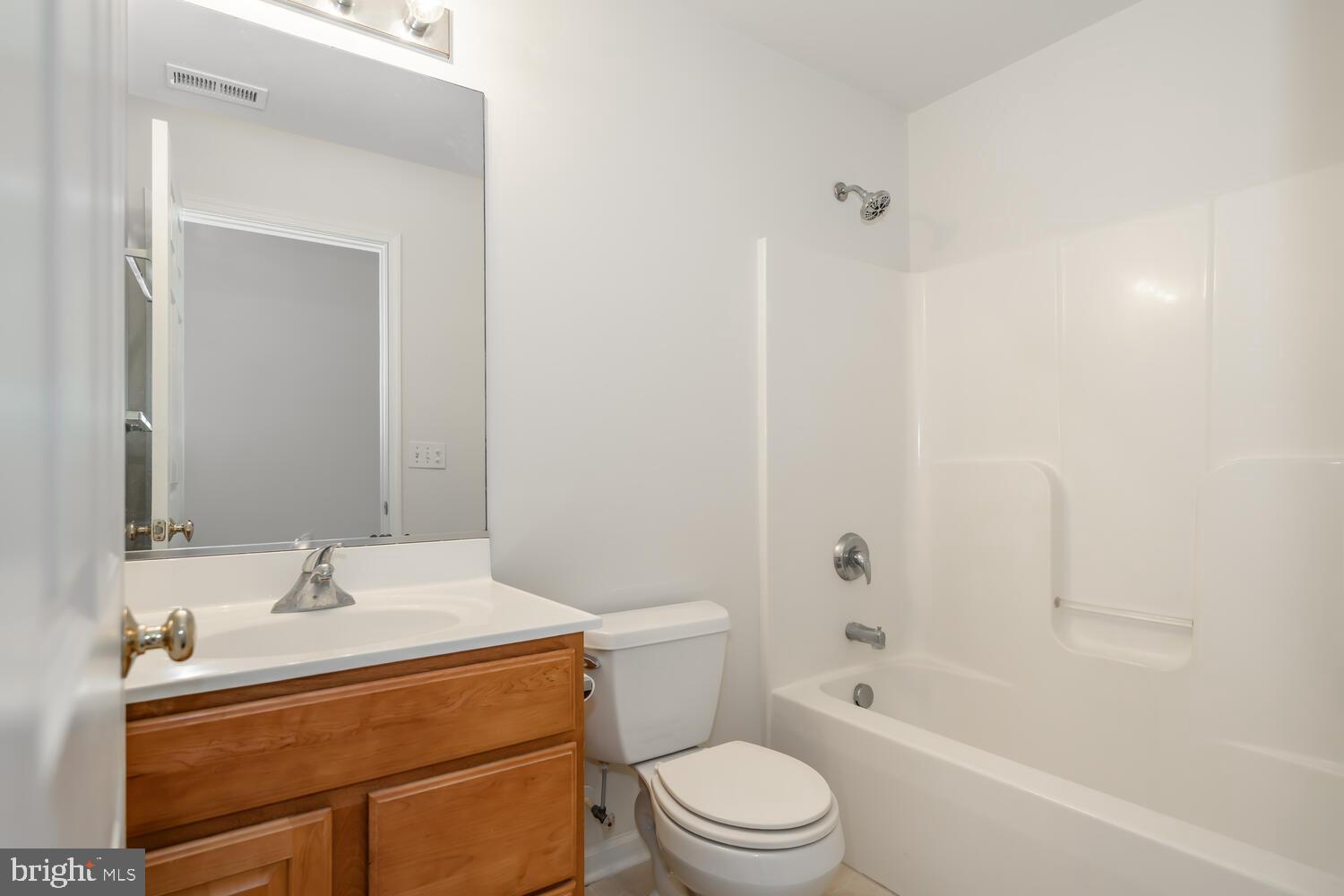 30224 Chestnut Ridge Lane Trappe, MD 21673 - Photo 34 of 46 a bathroom with a sink a toilet and shower