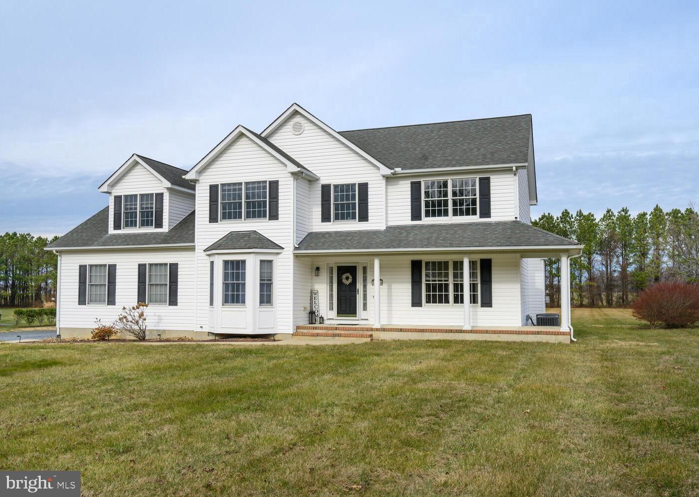 30224 Chestnut Ridge Lane Trappe, MD 21673 - Photo 40 of 46 a front view of a house with garden