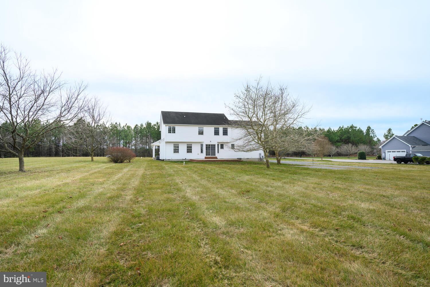 30224 Chestnut Ridge Lane Trappe, MD 21673 - Photo 4 of 46 a house view with swimming pool in front of it