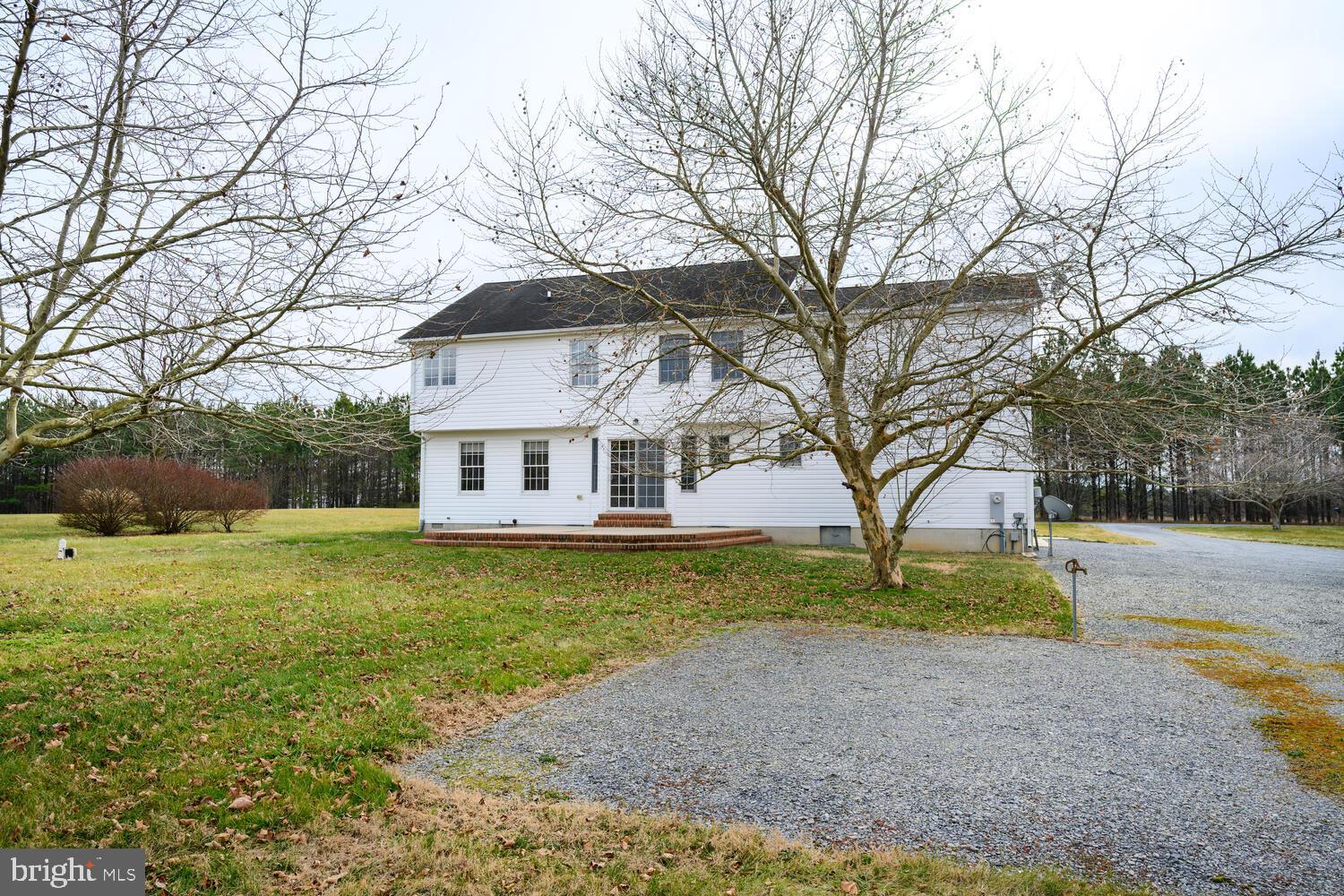 30224 Chestnut Ridge Lane Trappe, MD 21673 - Photo 41 of 46 a view of a house with a yard
