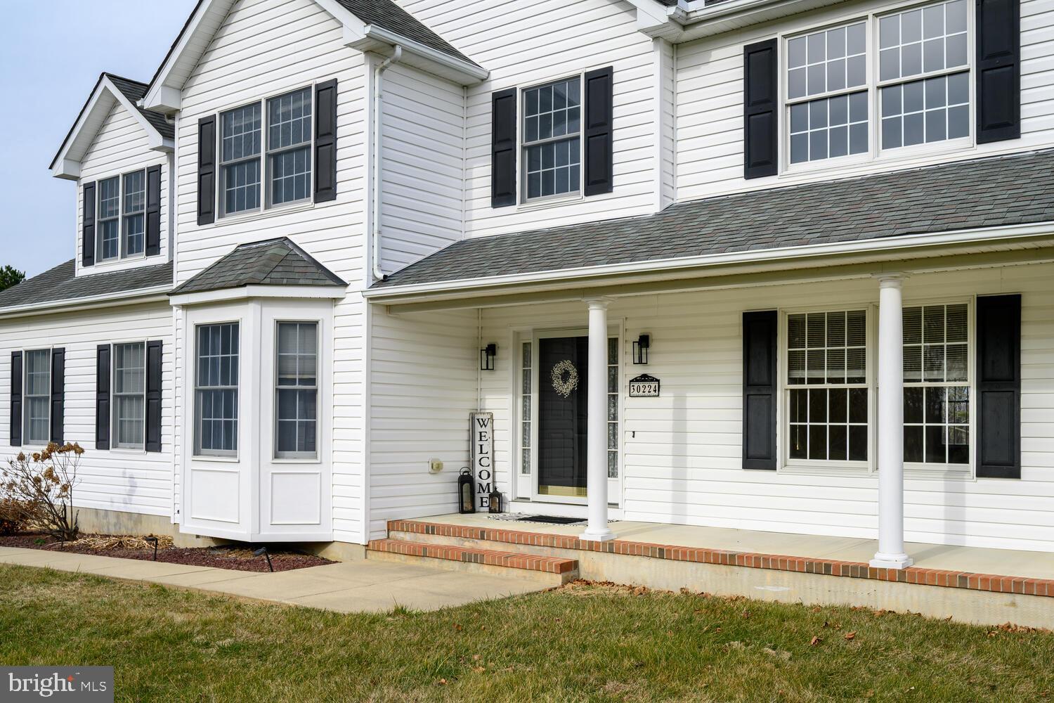 30224 Chestnut Ridge Lane Trappe, MD 21673 - Photo 42 of 46 front view of a house with a yard
