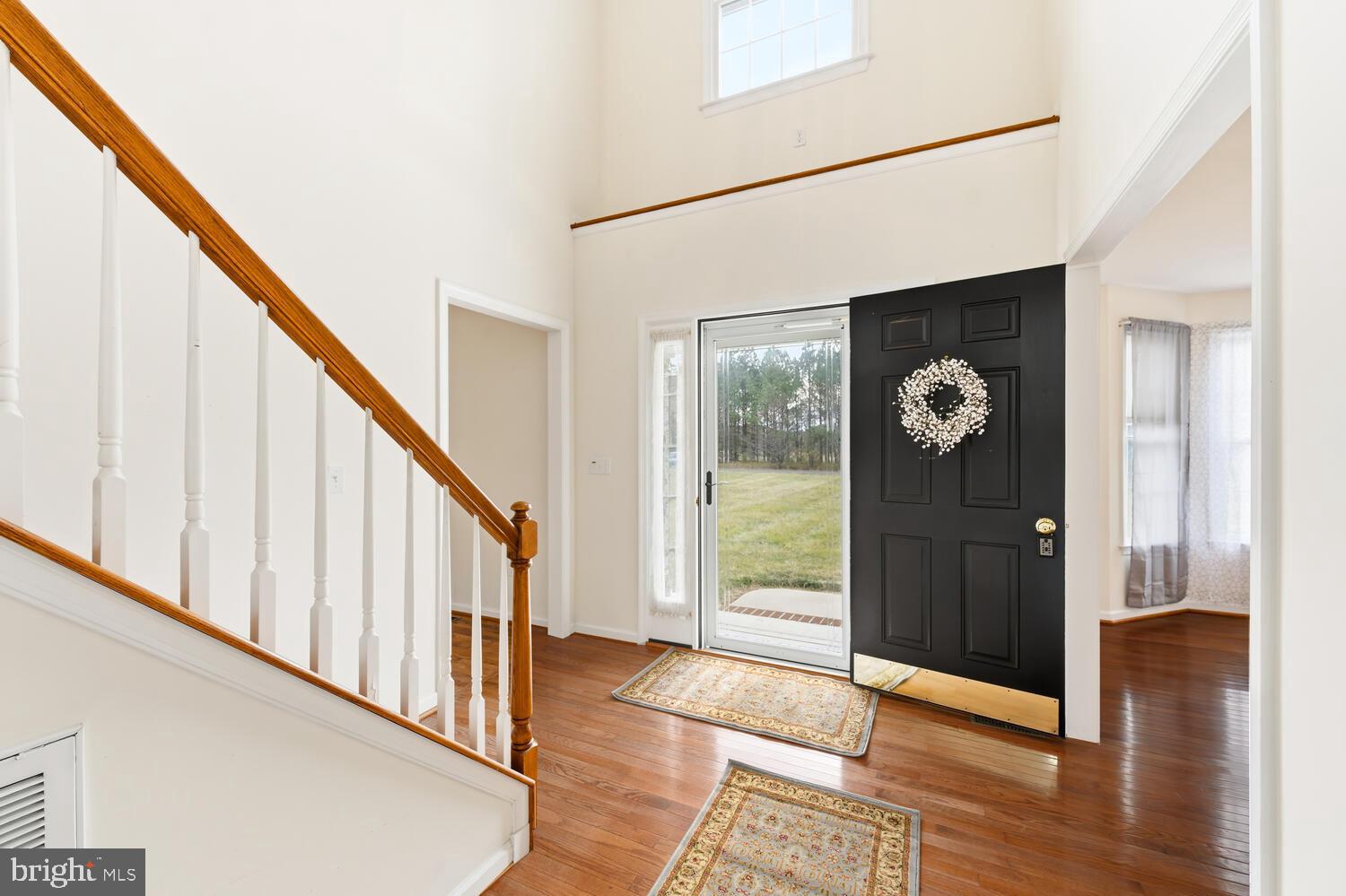 30224 Chestnut Ridge Lane Trappe, MD 21673 - Photo 6 of 46 a view of an entryway with wooden floor and door