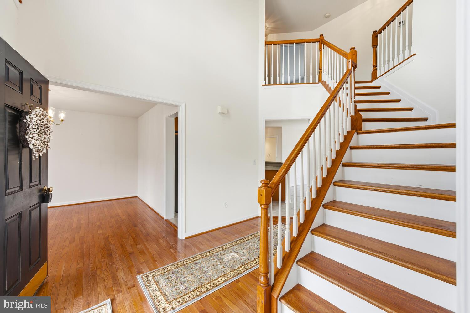 30224 Chestnut Ridge Lane Trappe, MD 21673 - Photo 7 of 46 a view of entryway with wooden floor and a front door