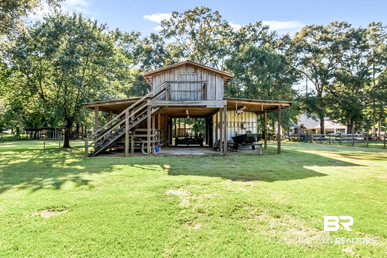 1360 Dykes Road North Mobile, AL 36608 - Photo 39 of 40 Back of house with a patio area, a yard, board and batten siding, and a wooden deck