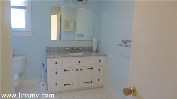 79 Old Purchase Road Edgartown, MA 02539 - Photo 12 of 14 a bathroom with a sink and a mirror