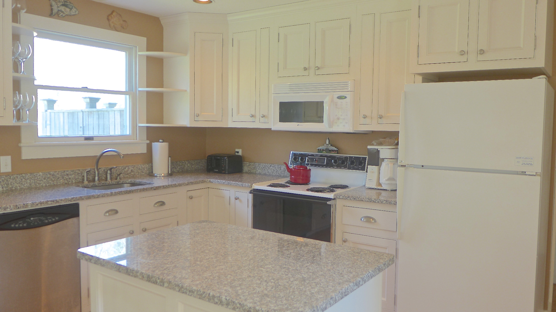79 Old Purchase Road Edgartown, MA 02539 - Photo 5 of 14 a kitchen with stainless steel appliances granite countertop a sink stove and refrigerator