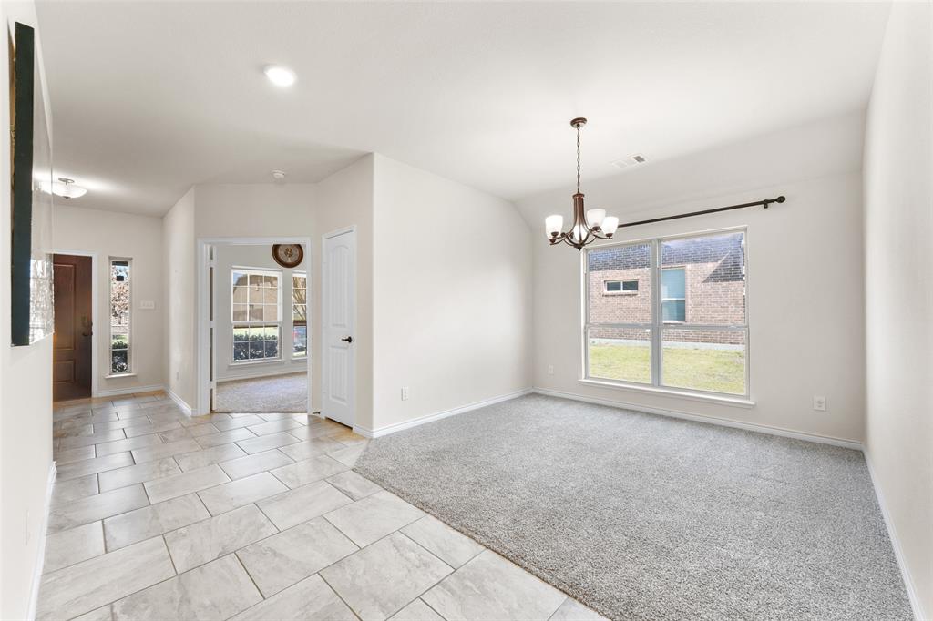 3031 Lily Lane Forney, TX 75126 - Photo 7 of 28 a view of a room with cabinet and windows
