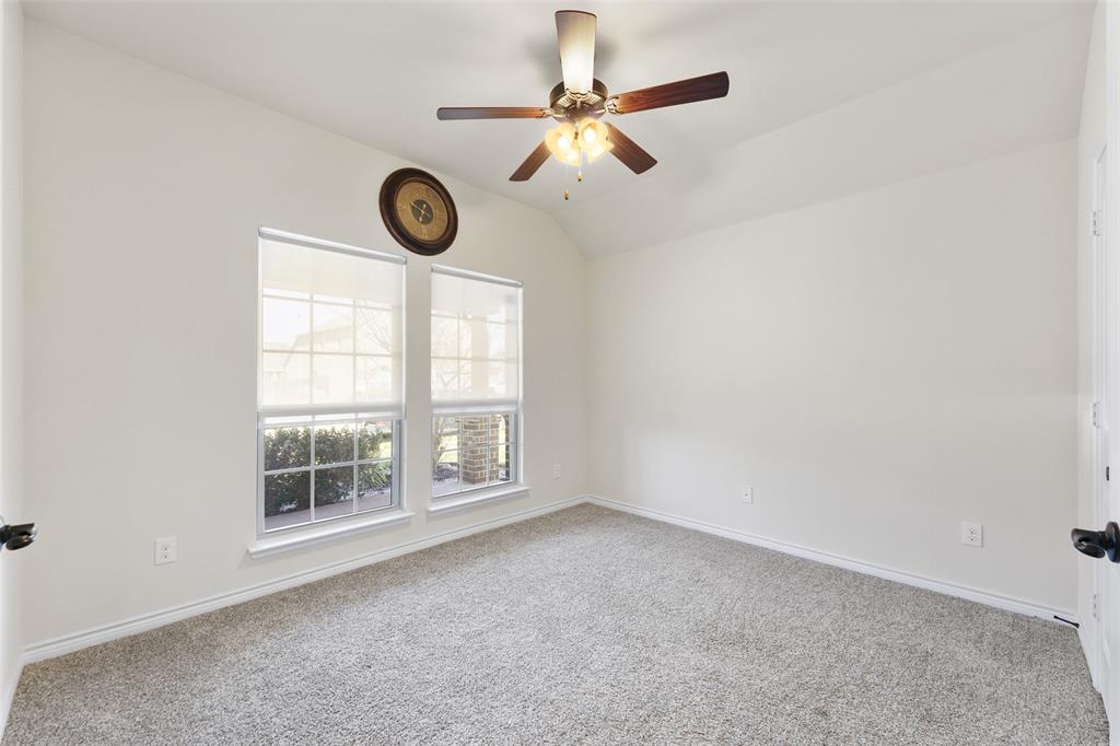 3031 Lily Lane Forney, TX 75126 - Photo 8 of 28 an empty room with windows and fan