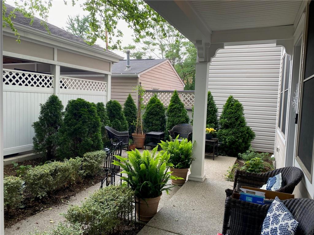706 Ivy Street, Unit 2 Pittsburgh, PA 15232 - Photo 3 of 35 a front view of a house with a yard and potted plants