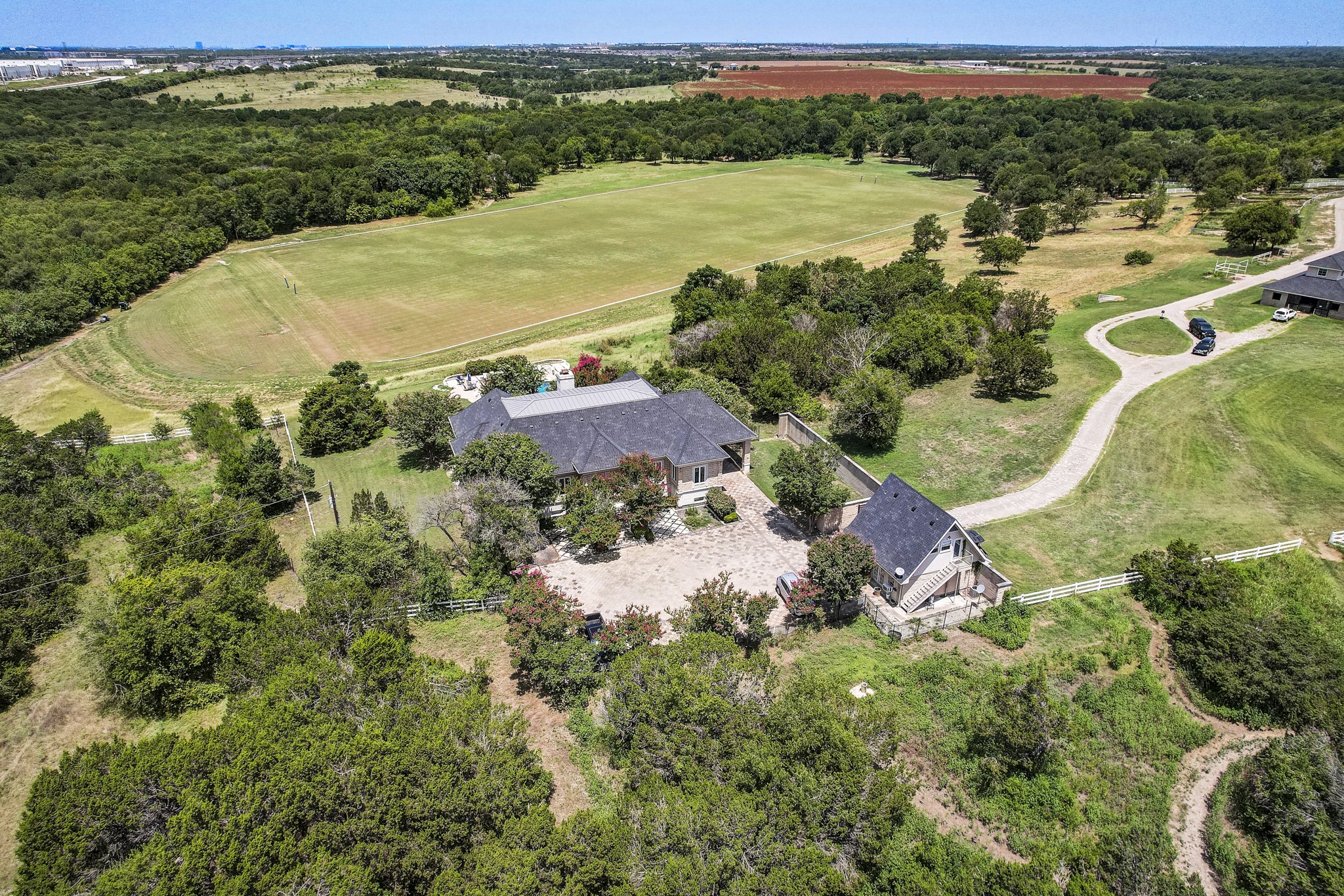 13628 Gregg Manor Road Manor, TX 78653 - Photo 5 of 33 an aerial view of residential houses with outdoor space and river