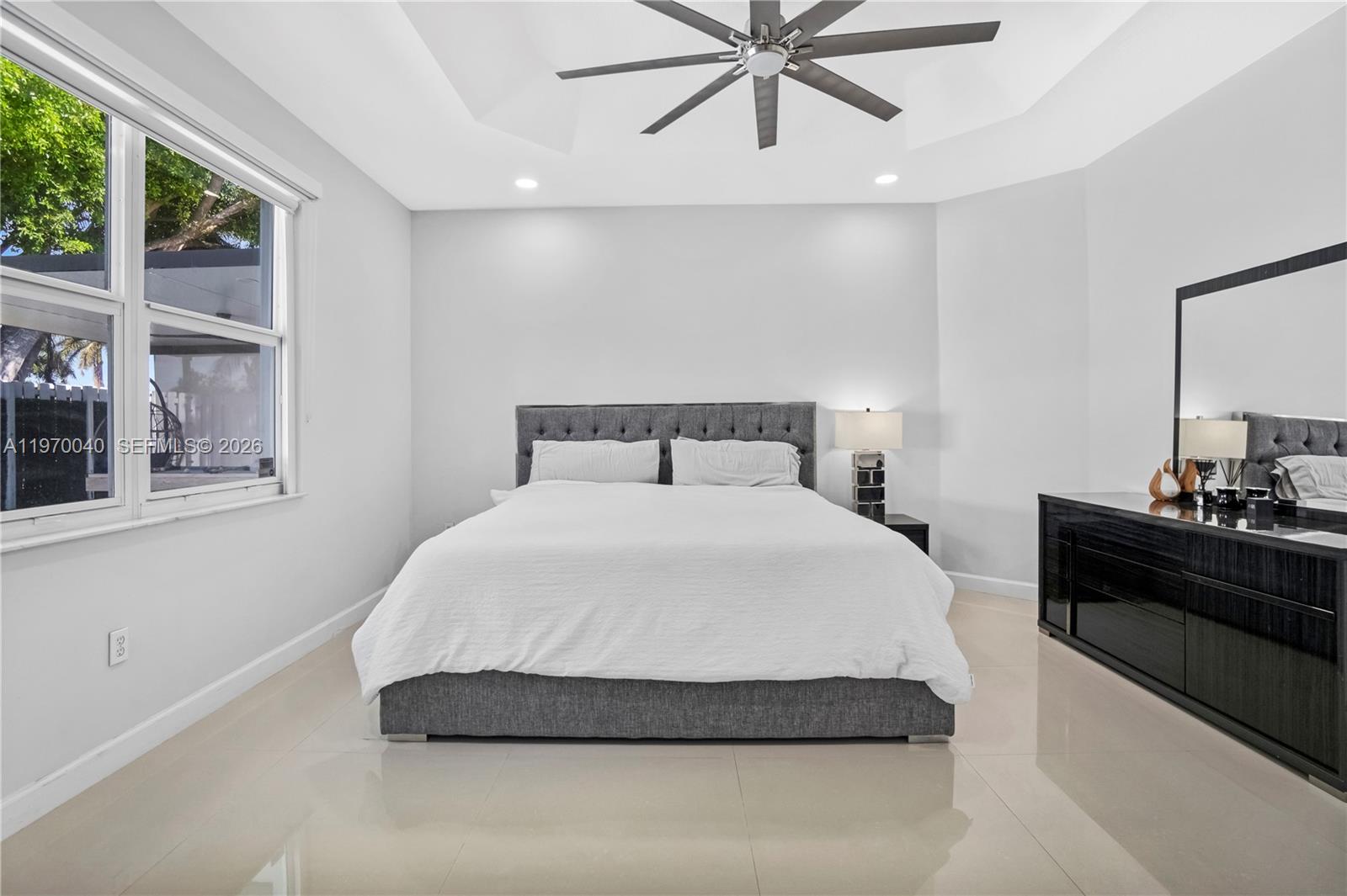 2132 Northeast 38th Road Homestead, FL 33033 - Photo 12 of 48 a bedroom with a bed and window