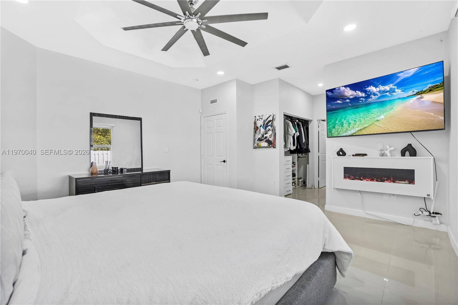 2132 Northeast 38th Road Homestead, FL 33033 - Photo 13 of 48 a bedroom with a bed and a flat screen tv