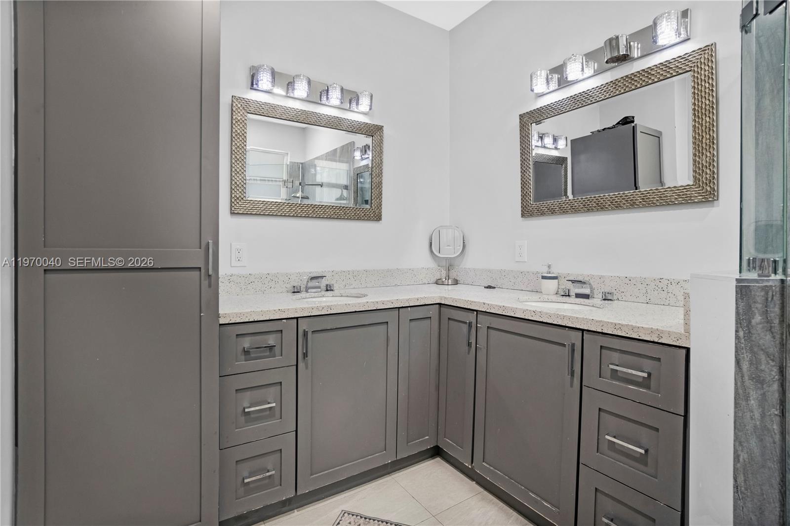 2132 Northeast 38th Road Homestead, FL 33033 - Photo 15 of 48 a bathroom with a sink vanity and mirror