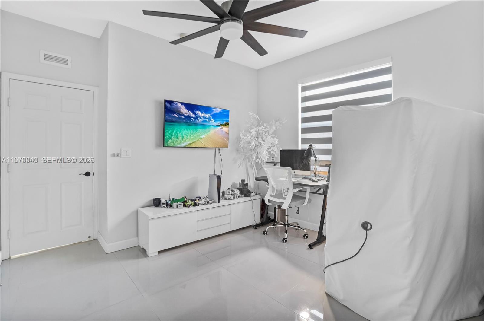 2132 Northeast 38th Road Homestead, FL 33033 - Photo 16 of 48 a living room with furniture and a flat screen tv