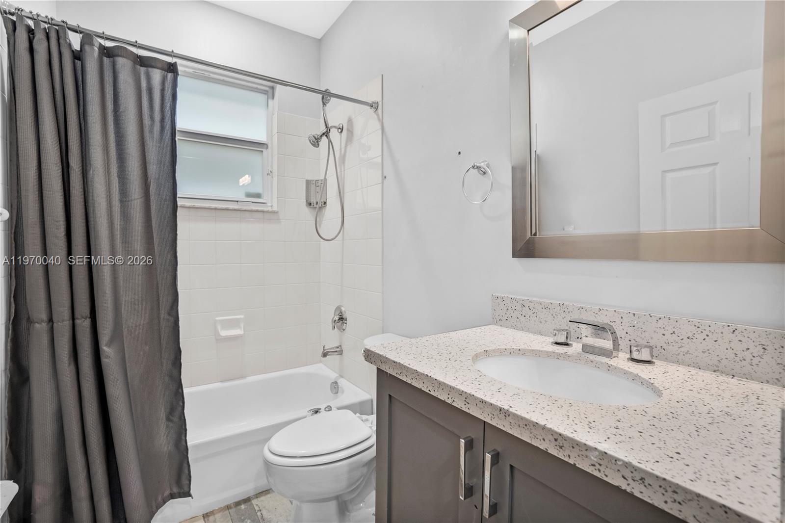 2132 Northeast 38th Road Homestead, FL 33033 - Photo 19 of 48 a bathroom with a granite countertop sink toilet and shower