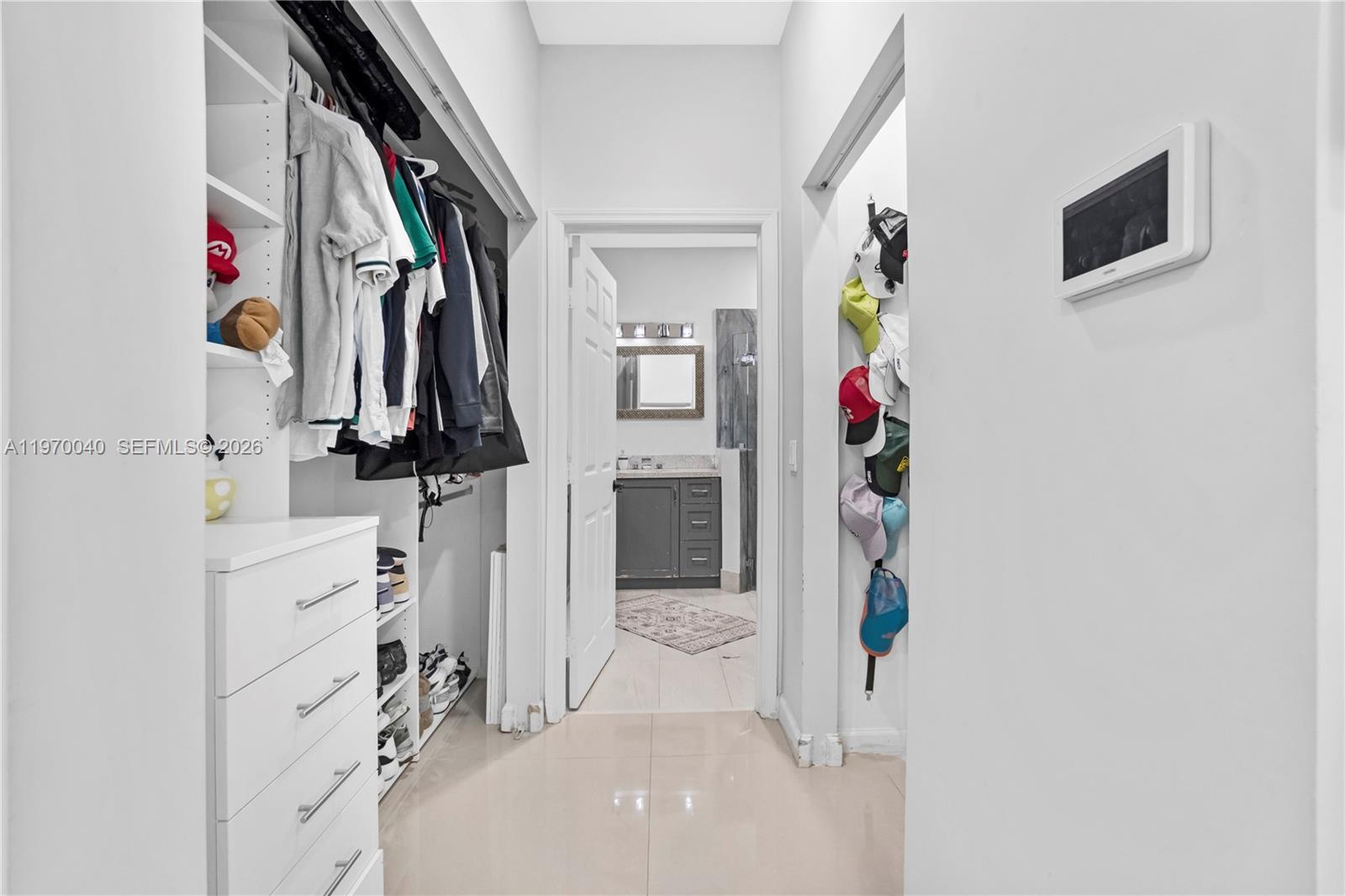 2132 Northeast 38th Road Homestead, FL 33033 - Photo 23 of 48 a view of walk in closet with clothes and shoes
