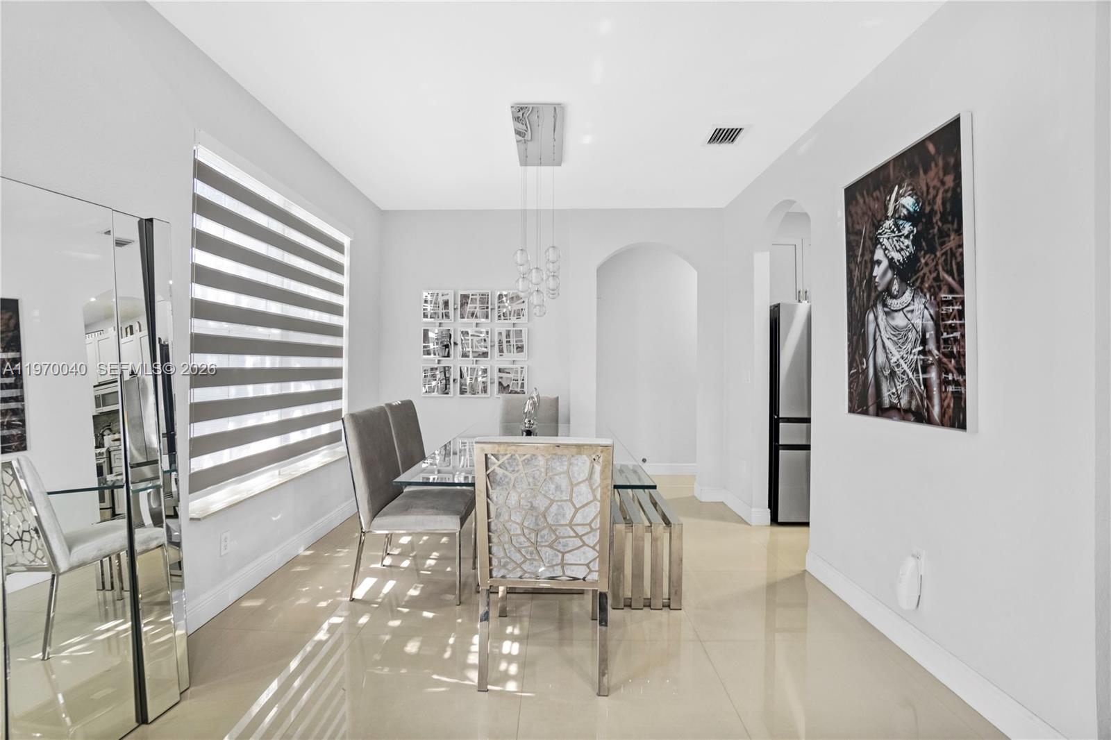 2132 Northeast 38th Road Homestead, FL 33033 - Photo 24 of 48 a dining room with furniture and wooden floor