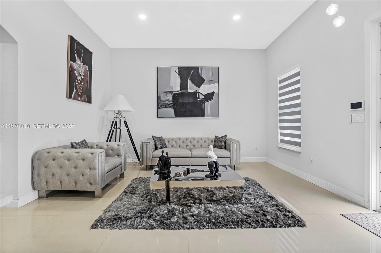2132 Northeast 38th Road Homestead, FL 33033 - Photo 25 of 48 a living room with furniture and a rug