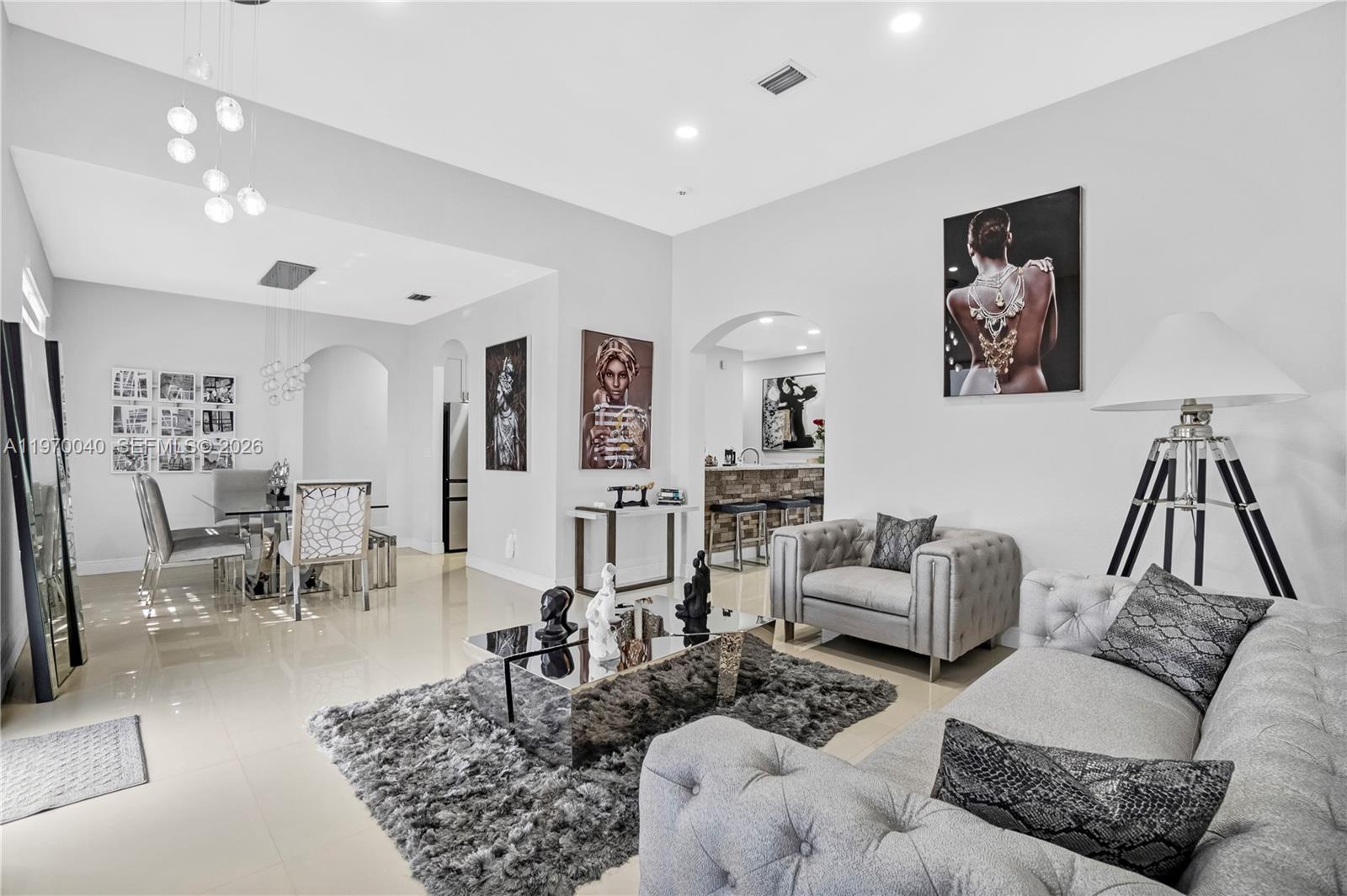 2132 Northeast 38th Road Homestead, FL 33033 - Photo 26 of 48 a living room with furniture and wooden floor