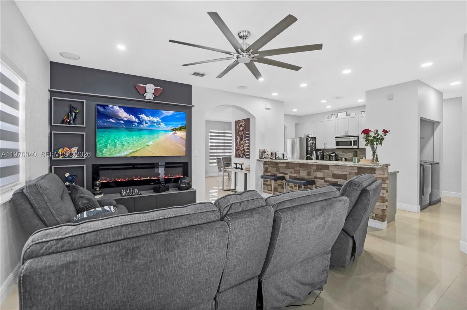 2132 Northeast 38th Road Homestead, FL 33033 - Photo 27 of 48 a living room with stainless steel appliances furniture and a flat screen tv