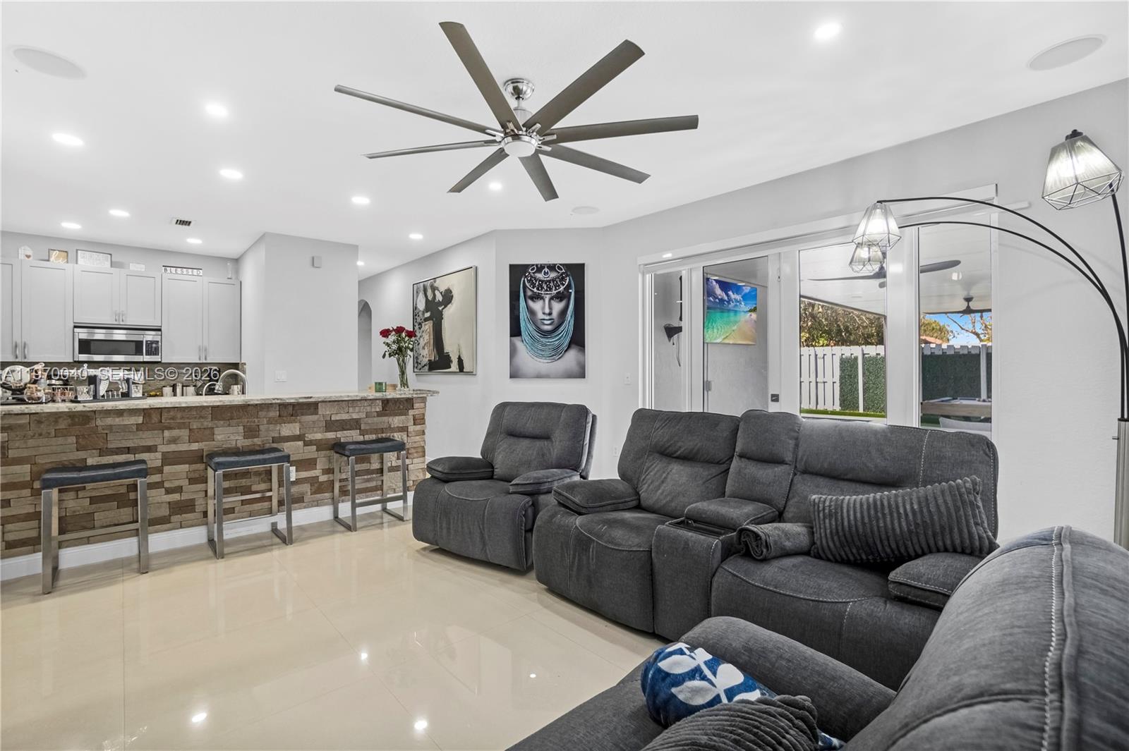 2132 Northeast 38th Road Homestead, FL 33033 - Photo 29 of 48 a living room with furniture kitchen view and a window