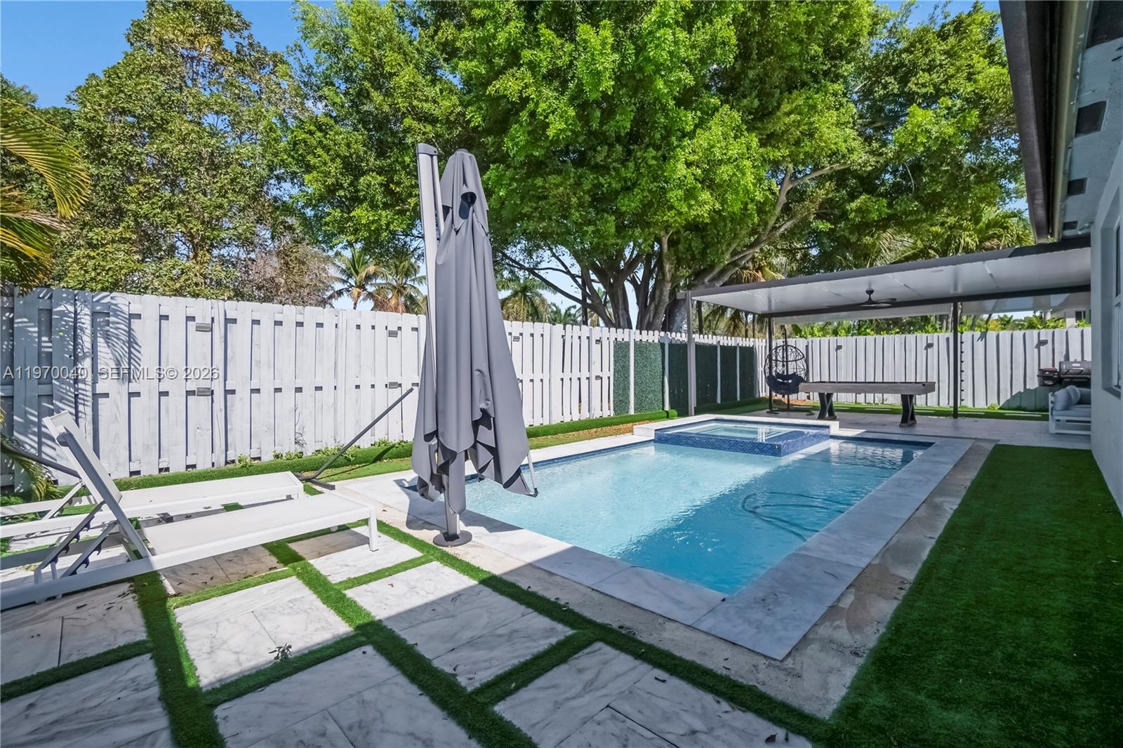 2132 Northeast 38th Road Homestead, FL 33033 - Photo 42 of 48 a view of a backyard with a patio and wooden floor
