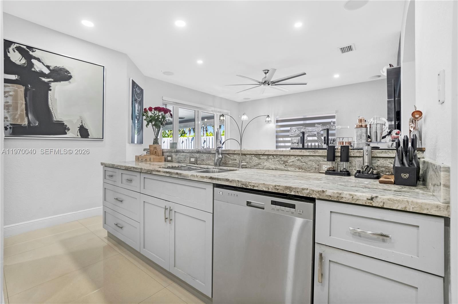 2132 Northeast 38th Road Homestead, FL 33033 - Photo 9 of 48 a bathroom with a granite countertop sink mirror and double