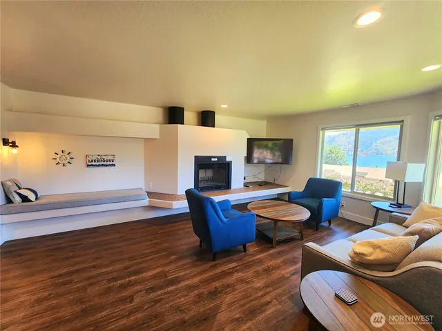 a kitchen with kitchen island a sink appliances and cabinets