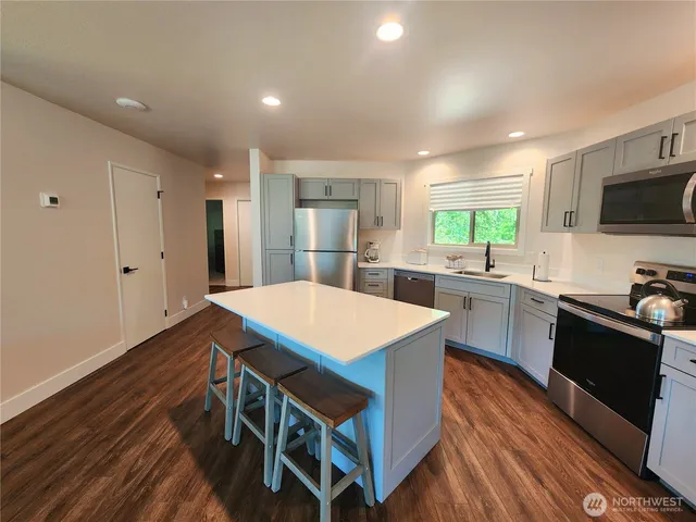 a dining room with furniture window and wooden floor