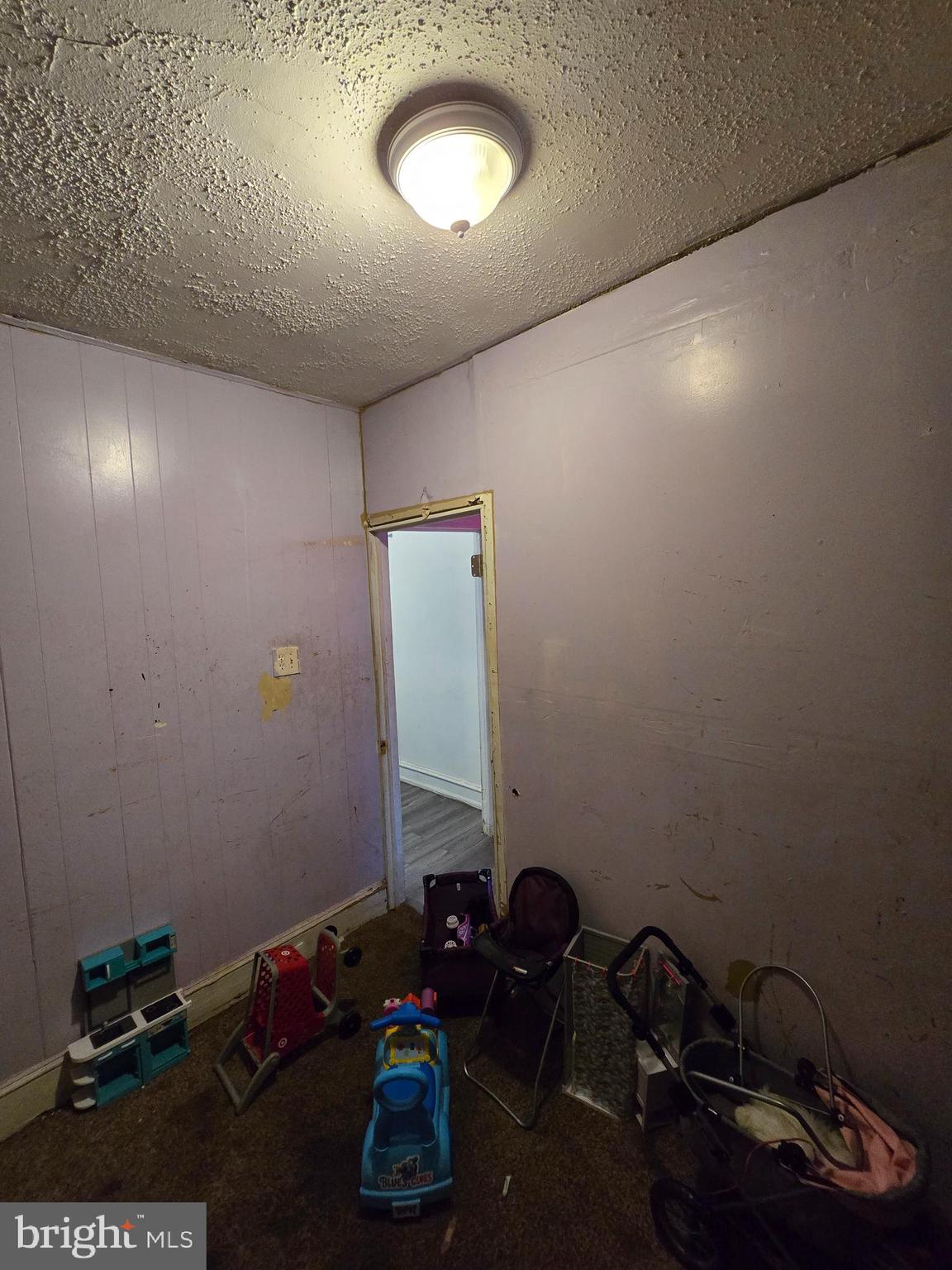 620 West 2nd Street Chester, PA 19013 - Photo 12 of 24 a room with a mirror and a wooden floor