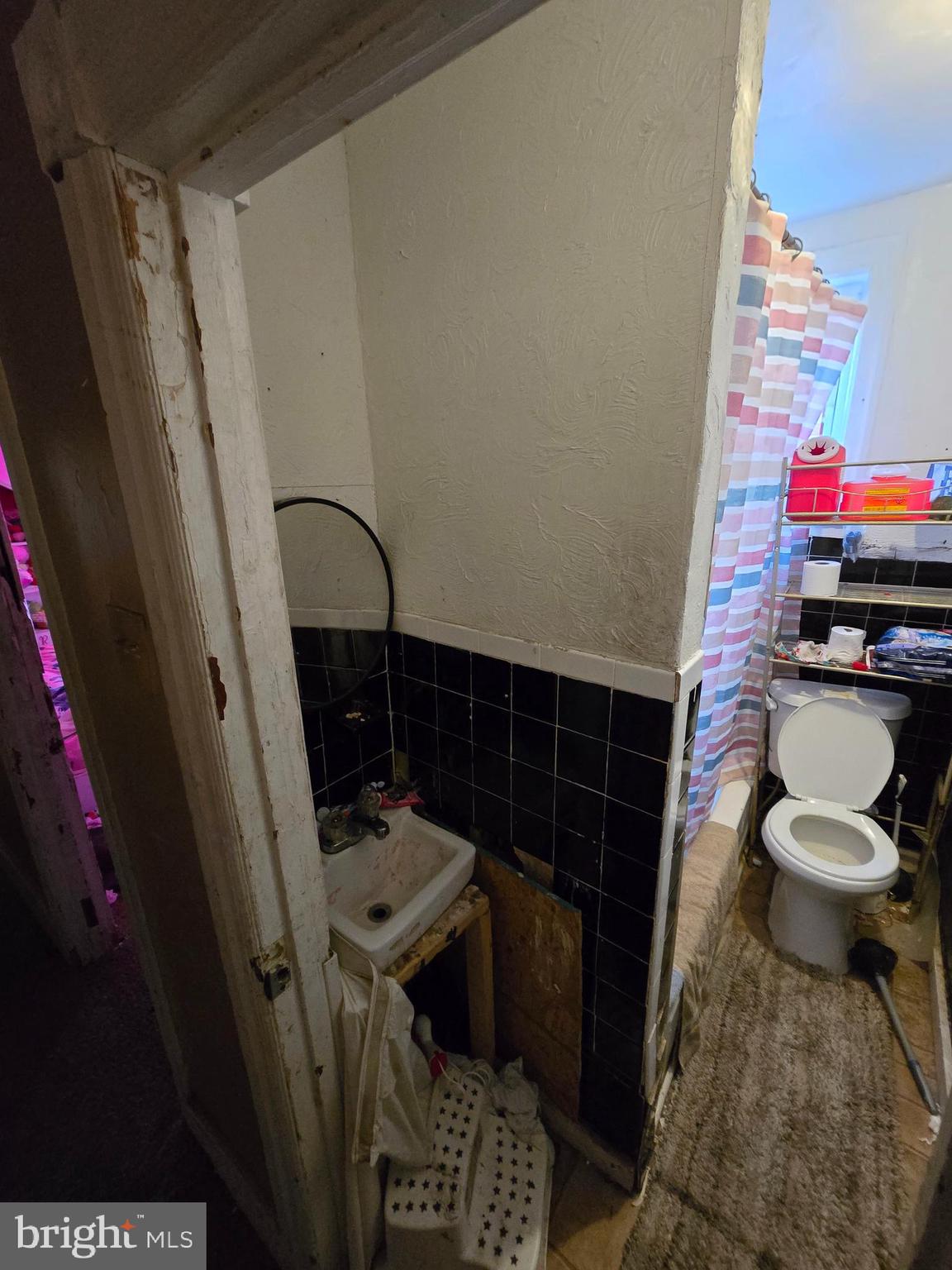 620 West 2nd Street Chester, PA 19013 - Photo 20 of 24 a bathroom with a sink and a toilet