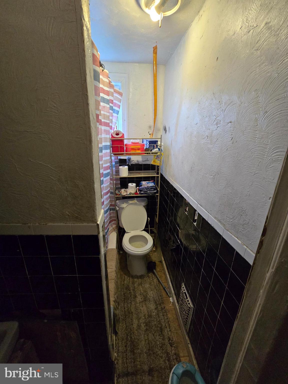620 West 2nd Street Chester, PA 19013 - Photo 21 of 24 a bathroom with a sink and a mirror