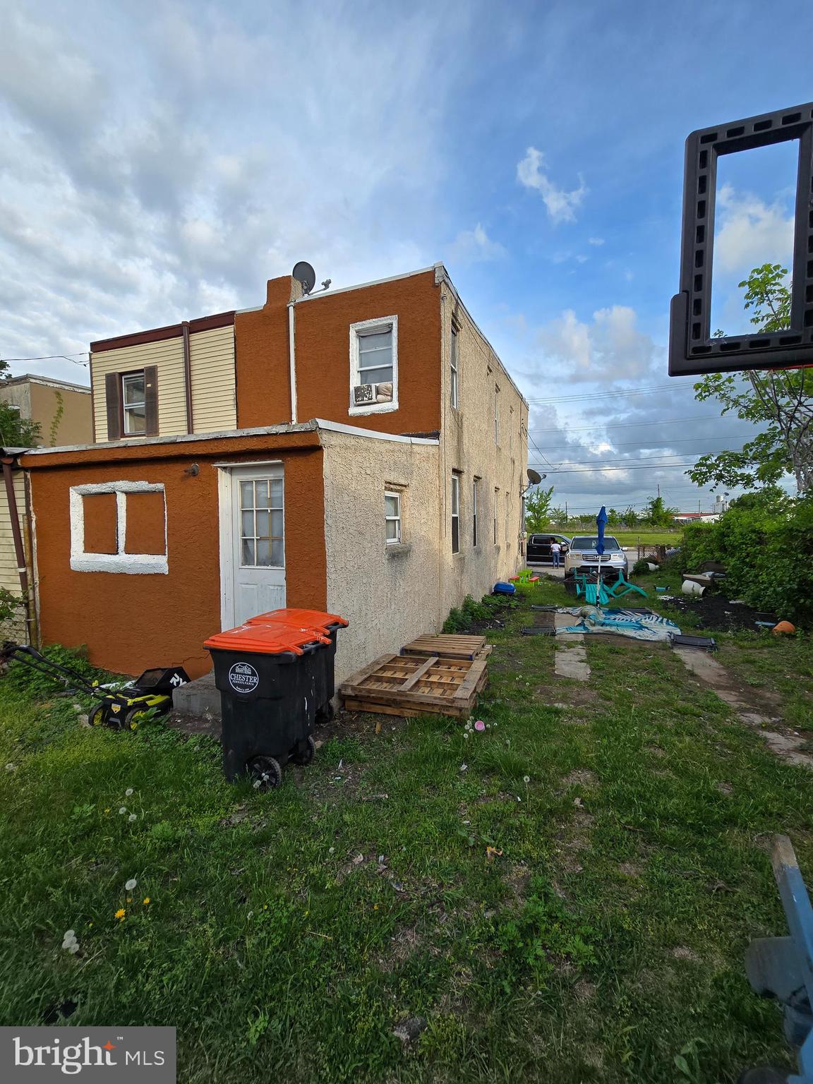 620 West 2nd Street Chester, PA 19013 - Photo 3 of 24 a front view of a house with a garden