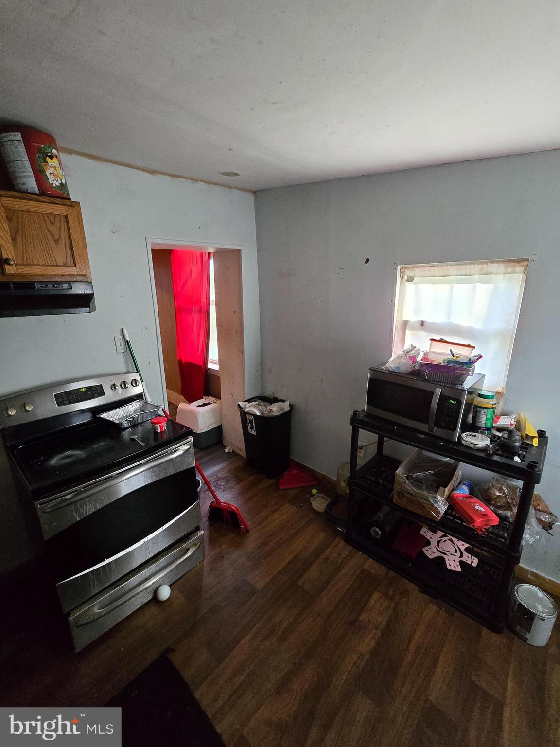 620 West 2nd Street Chester, PA 19013 - Photo 10 of 24 a room with furniture a flat screen tv and a bookshelf