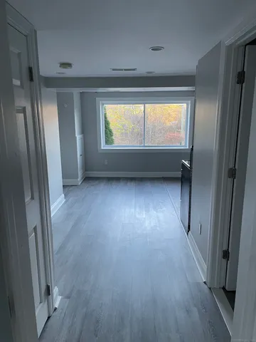 a view of wooden floor and brick walls