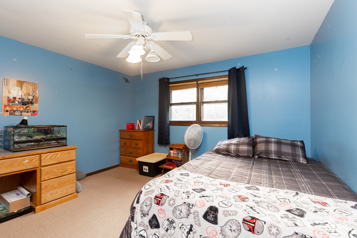 3570 Arthur Road Crete, IL 60417 - Photo 22 of 38 a bedroom with a bed and wooden floor