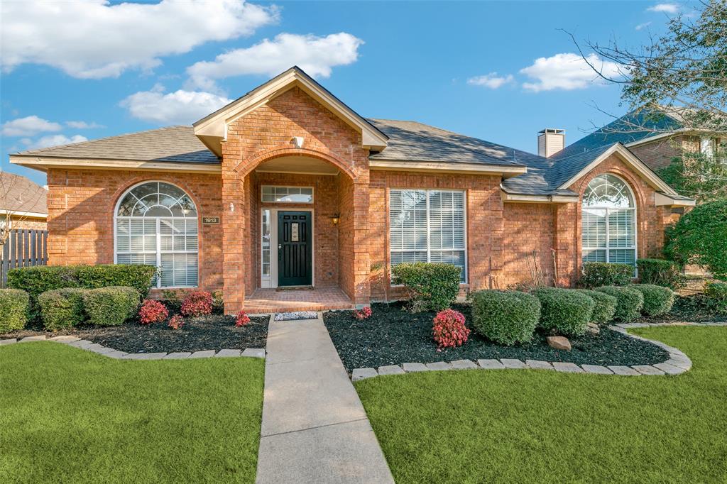 1913 Smith Drive Plano, TX 75023 - Photo 1 of 12 a front view of a house with garden