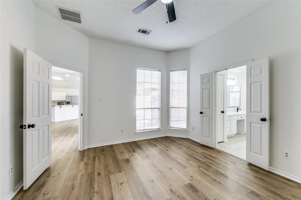 1913 Smith Drive Plano, TX 75023 - Photo 7 of 12 wooden floor in an empty room with a window