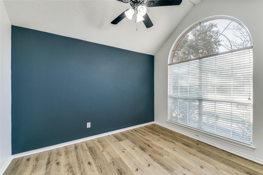 1913 Smith Drive Plano, TX 75023 - Photo 9 of 12 an empty room with a large window